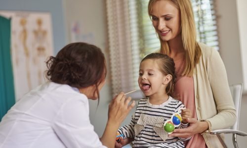 Routine examination of little girl's throat